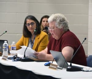 Chardon Board of Education President Karen Blankenship reads from a statement censuring board member Todd Albright Sept. 19.