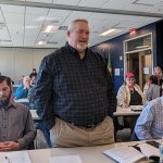 AMY PATTERSON/KMG Chardon Township Trustee Mike Brown, standing, aggressively questioned a decision by the Geauga Public Health board to partner with the Lake County General Health District. Brown also serves as secretary on the Geauga County Health District Advisory Council which, hours later, removed GPH Board President Richard Piraino from his seat.